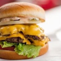 Double Cheeseburger · Double the beef, double the cheese served with American cheese, pickle, lettuce, onion, toma...