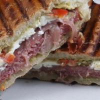 Godfather Panini · Salami, prosciutto, fresh mozz, roasted peppers, and pesto aioli, grill-pressed on our Cuban...