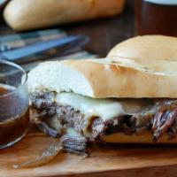 French Dip · Warm house roast beef, caramelized onions, and melted Swiss served on a hero roll with au ju...