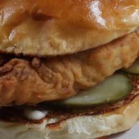Fried Chicken Sandwich · Breast meat chicken fried golden brown with a roasted garlic aioli and house pickles, served...