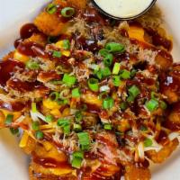 Loaded Cheese Tots · Fresh, hot tots loaded with melted cheddar and Monterey Jack cheeses, fresh scallions, and s...