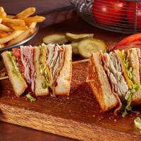 Club Sandwich
 · Thinly sliced roasted turkey and ham, crispy bacon, Monterey Jack, and cheddar cheeses, lett...