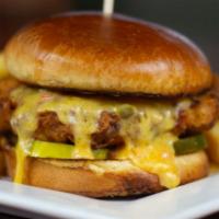 Sweet & Cheesy Fried Chicken Sandwich · Chicken breast hand-breaded and golden fried, topped with ooey gooey Southern pimento cheese...