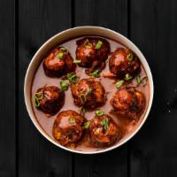 (Vegan) Veggie Manchurian · Vegetable dumplings are tossed in a spicy sauce with green onions and an Indo-Chinese Manchu...