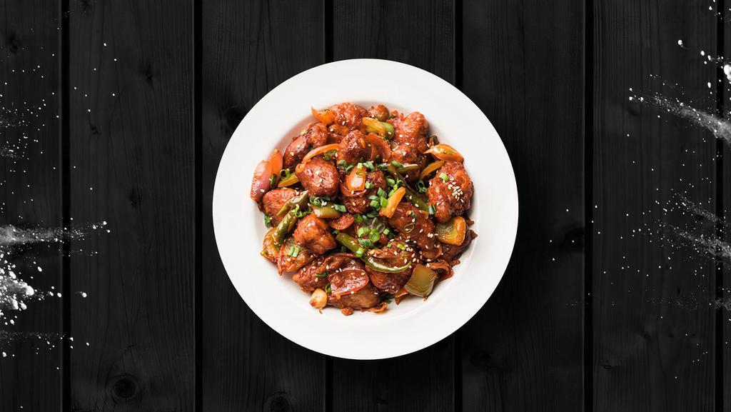 (Vegan) Cauli Manchurian · Crispy fried cauliflower florets are tossed in a spicy sauce with green onions and an Indo-Chinese manchurian sauce.