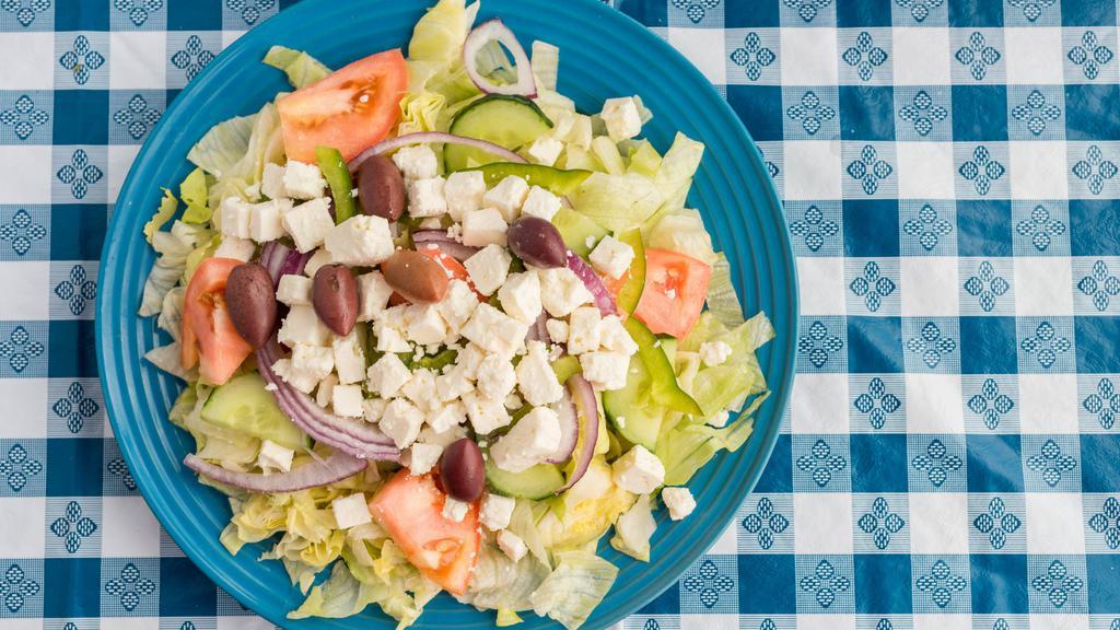 Greek Salad · Lettuce, tomato, cucumber, onions, feta, green pepper, Kalamata olives and homemade dressing.