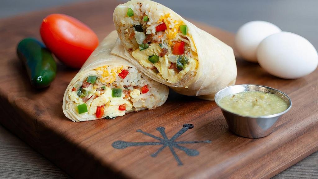 Southwest Veggie Burrito · Flour tortilla filled with bacon, cage-free scrambled eggs, cheddar & jack cheeses, red bell peppers, poblano & jalapeño peppers, onions, and hash browns.