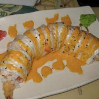 Tropical Roll · Two pieces of fried coconut shrimp, cucumbers, avocados, snow crab, spicy salmon wrapped in ...