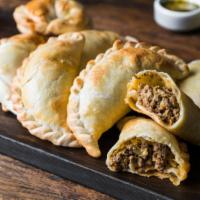 Sausage, Egg, And Cheese Empanada · Delicious baked turned over stuffed with sausage, egg, and cheese.