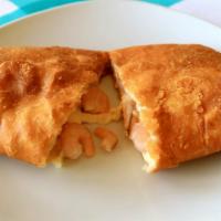 Pollo Empanada · Yummy baked turnover stuffed with chicken, onions, red bell pepper, hard-boiled egg, green o...