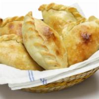 Ham, Cheese And Sausage Empanada · Mouthwatering empanada stuffed with ham, cheese, and sausage.