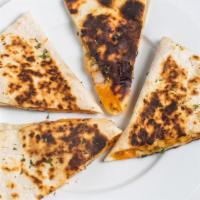Shrimp Quesadilla · Fresh louisians shrimp, swiss and cheddar cheese, onioon, and bacon. Served with sour cream ...
