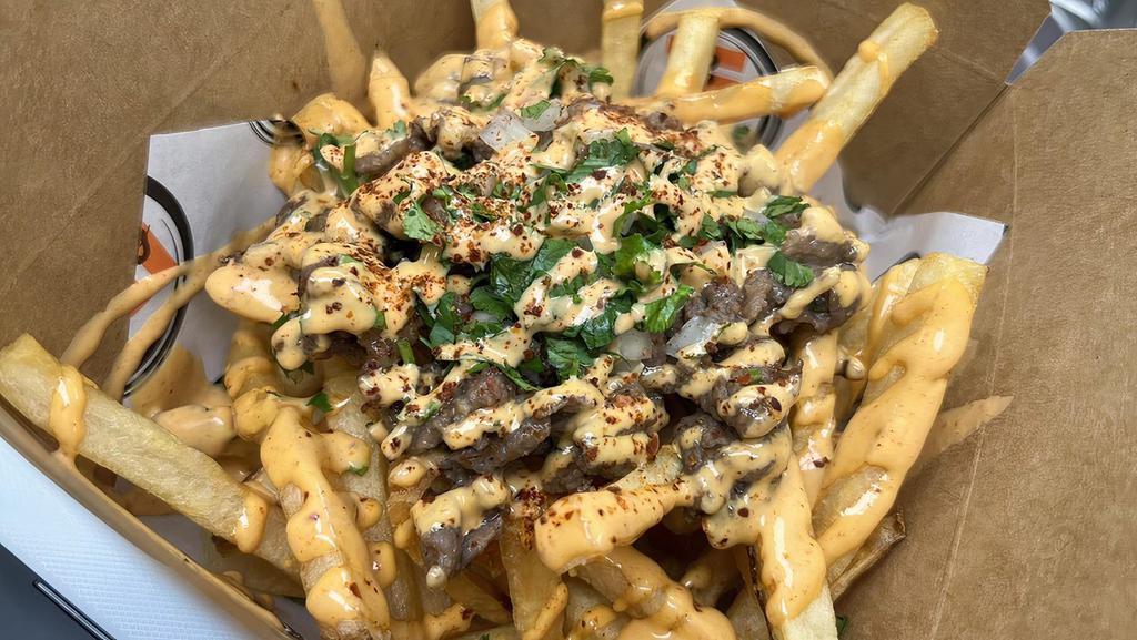 Bulgogi Fries · French fries and beef bulgogi topped with cilantro, onions, and spicy aioli.