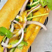 Tofu Banh Mi · Pickled carrots, pickled cucumbers, pickled jalapenos, shaved red onions, cilantro, and thai...
