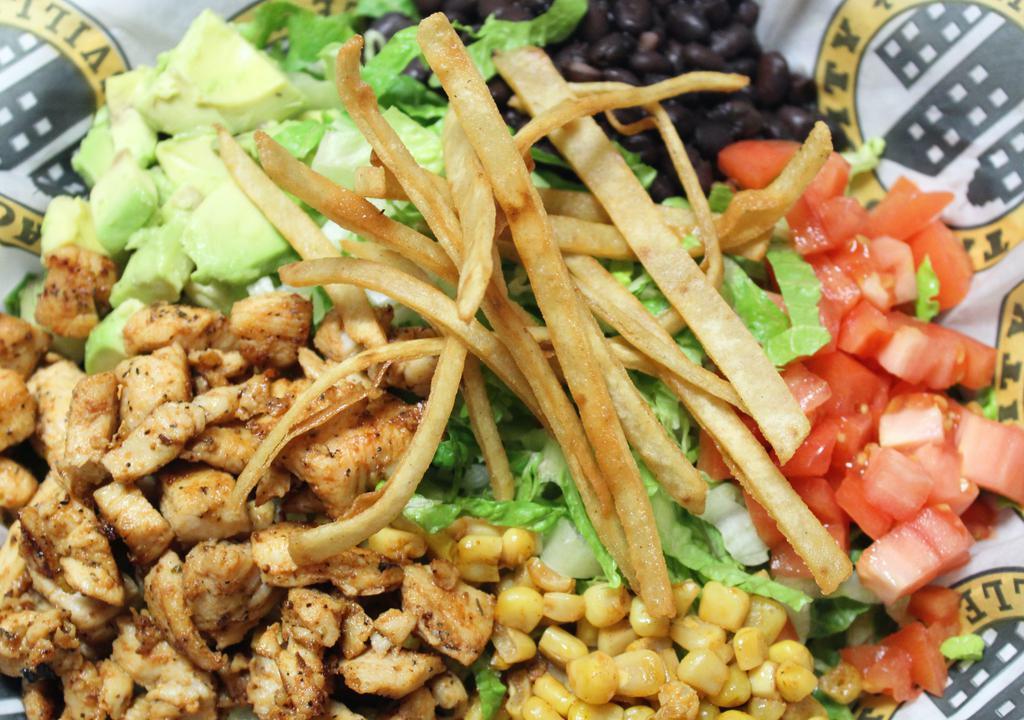 Mexican Caesar Salad · Romaine lettuce, grille chicken, roasted corn, black or pinto beans, avocado, tomato, tortilla strips, nd cilantro caesar dressing.