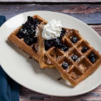 Mountain Blueberry Buttermilk Waffle · topped with scratch-made blueberry compote, fresh blueberries, whipped cream, powdered sugar