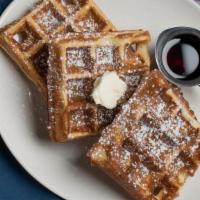Classic Buttermilk Waffle · topped with whipped butter, powdered sugar