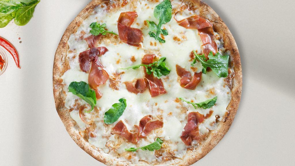 Prosciutto Italiano Pizza · An olive oil glaze with fresh garlic, topped with a bed of mozzarella cheese, sun-dried tomatoes, fresh mushroom, roasted red peppers, imported prosciutto ham and fresh basil.