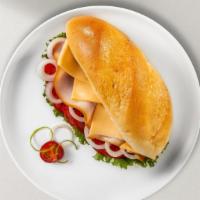 Turkey Sub · Hot or cold. Deluxe turkey breast with red onions, banana peppers, provolone cheese, shredde...