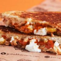 Buffalo South · Pepper jack, grilled chicken, buffalo sauce, bleu cheese crumble, and pickled celery on coun...
