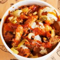 Buffalo Tots · Tater tots topped with cheese sauce, bleu cheese crumbles, grilled chicken, house buffalo sa...