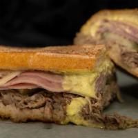 Cuban · Braised pork shoulder with ham, swiss cheese, pickles, and mayo-must.