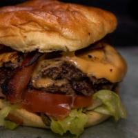 Bomb Burger · Nothing beats a good burger. Two 4 oz patties with our special sauce, lettuce, tomato, pickl...