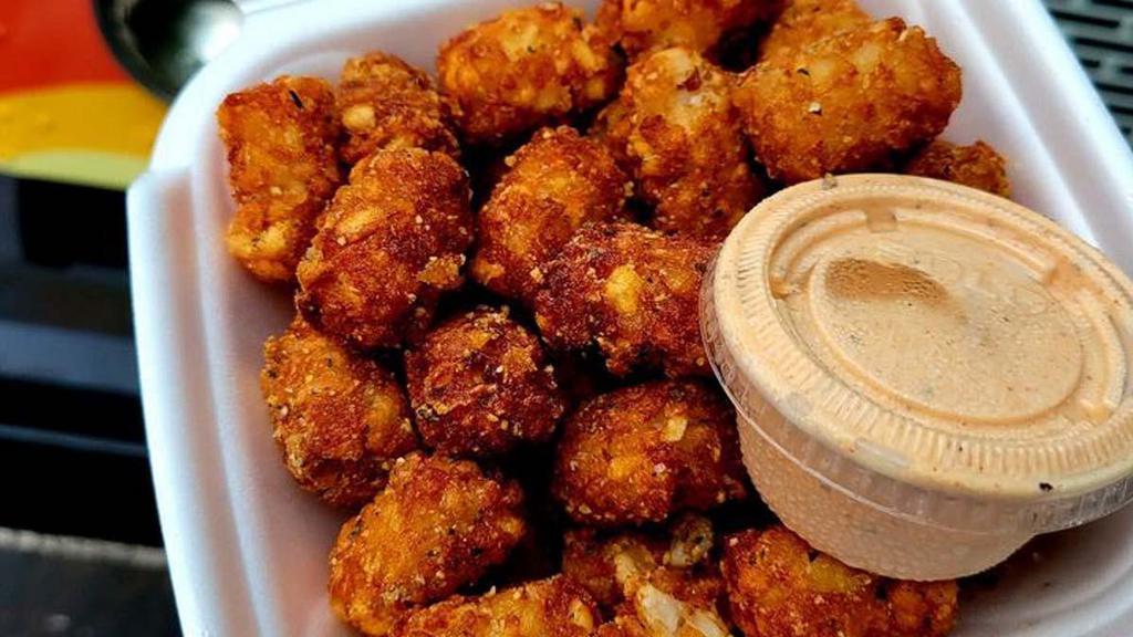 Tater Tots · Made to order tater tots. Top them with bacon and cheese for a real treat. Served with bomb sauce.