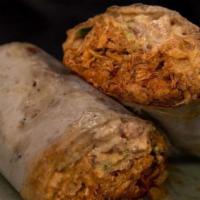Bomb Burrito · This is our version of a burrito. Braised spicy chipotle chicken thighs, fresh homemade sals...