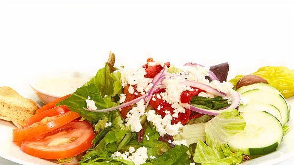 Greek Salad · A mix of lettuces, tomatoes, cucumbers, roasted red peppers, red onions, feta, pepperoncini, Kalamata olives, and Greek dressing.