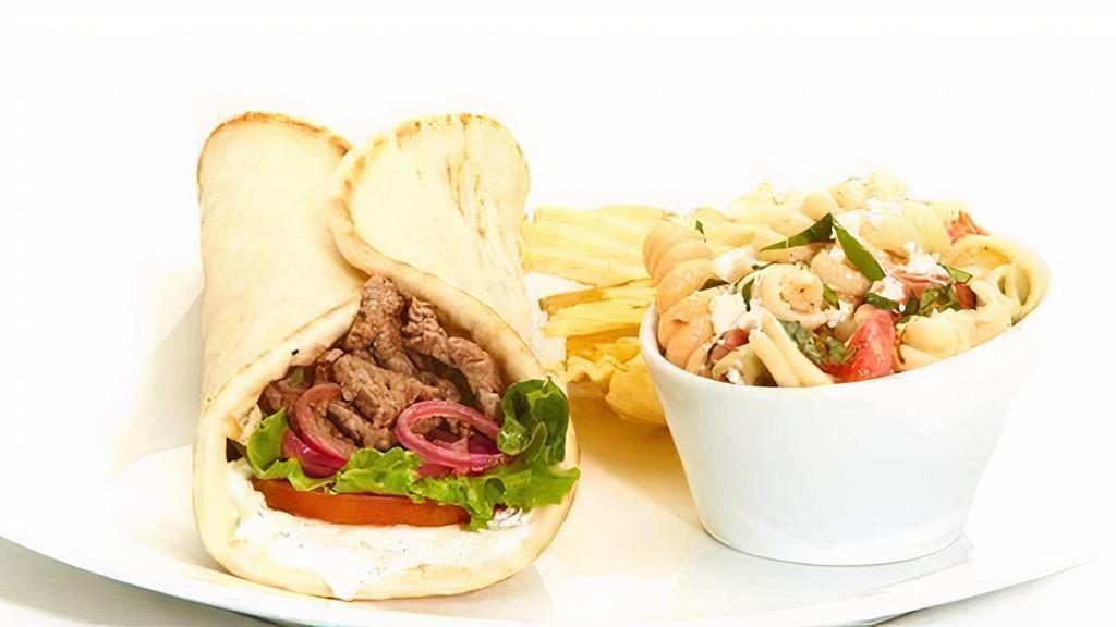Grilled Lamb Gyro · Sauce, tomatoes, mixed lettuce, and grilled onions. Served with chips and choice of a side.