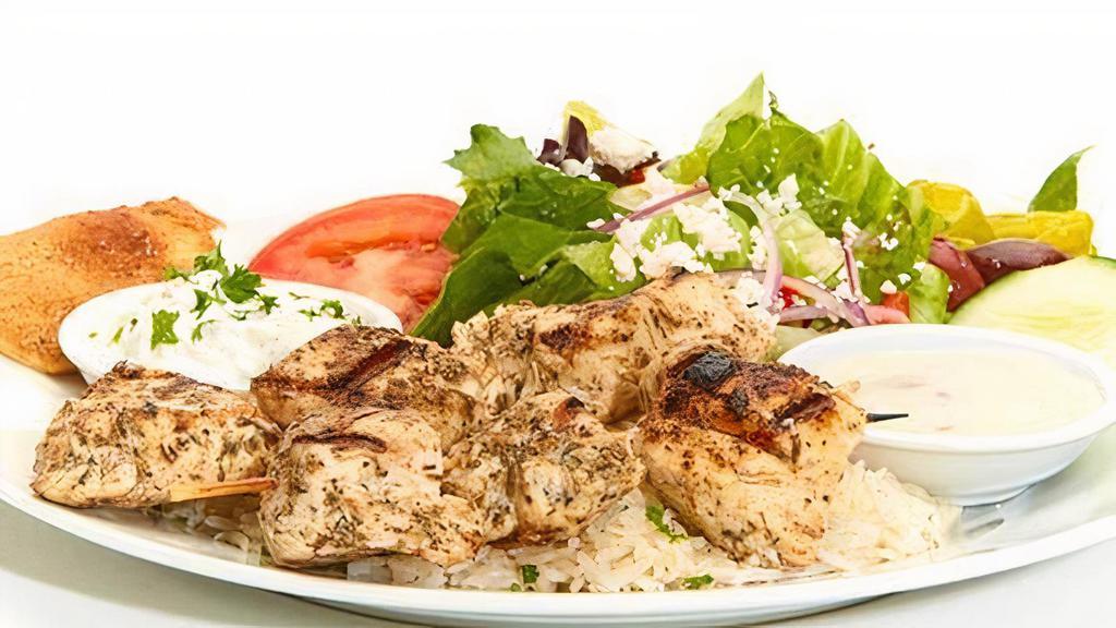 Chicken Kebob Feast · Marinated Chicken breast with a lemon tang. Served with our Taziki sauce. Served with Greek salad and your choice of roasted new potatoes or basmati rice.