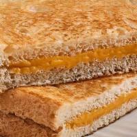 Grilled Cheese · American cheese on toasted bread. Includes choice of homemade sides.