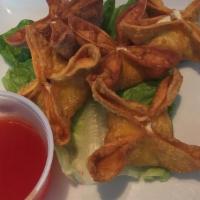 Crab Wontons (5) · Wontons filled with blue crab meat, cream cheese, and scallions, served with duck sauce.