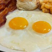 #1 Two Eggs Breakfast Meal · choice of bacon, ham, country or turkey sausage patties, with home fries or cheese grits, to...