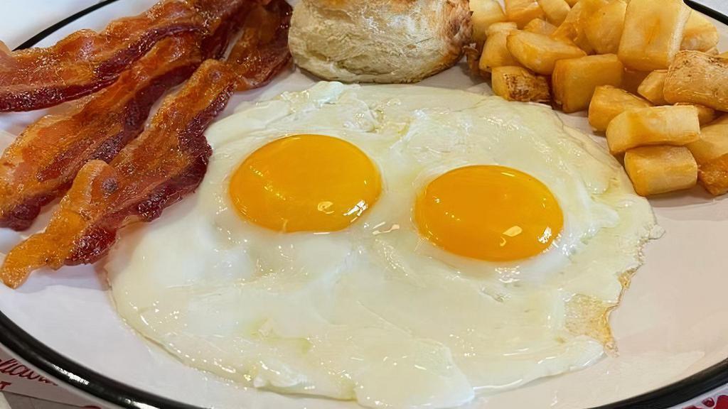 #1 Two Eggs Breakfast Meal · choice of bacon, ham, country or turkey sausage patties, with home fries or cheese grits, toast or biscuits