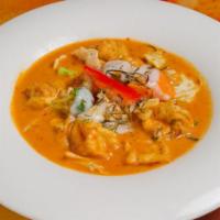 Panang Curry · Medium spicy. Savory curry peanut sauce combined with coconut milk and a julienne of kaffir ...