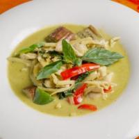 Green Curry · Medium spicy. Thai green curry paste with bamboo shoots, bell pepper, eggplant and basil lea...