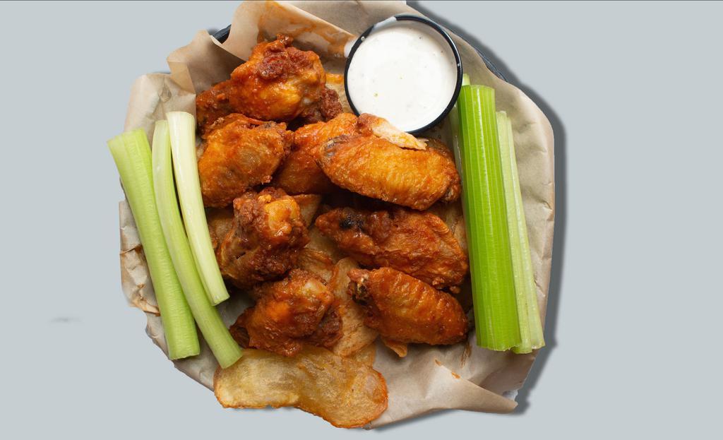 Classic Wings · Choice of 8 or 12 bone-in chicken wings tossed in one of our tasty sauces. Served over housemade Old Bay chips with ranch or bleu cheese dressing.