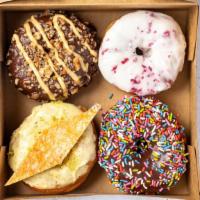 Assorted Doughnuts (4) · Chef's choice of 4 handmade doughnuts (donuts).