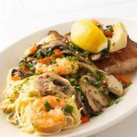 Grilled Fish Orleans · Grilled fish topped with shrimp, mushrooms, and artichoke hearts, served with pasta. Recomme...
