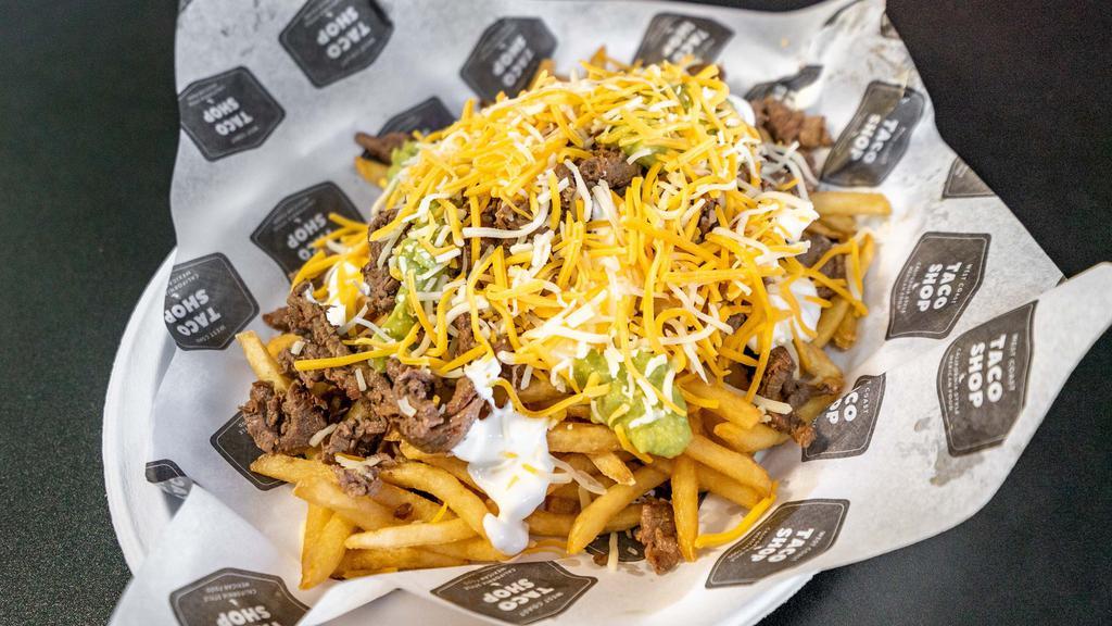 Carne Asada Fries · Steak. Topped with sour cream, guacamole and cheese.