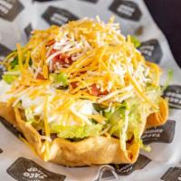 Veggie Taco Salad · Rice, beans, lettuce, tomatoes, sour cream, guacamole and cheese.