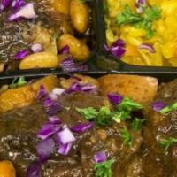 Jamaican Oxtails Only · Braised oxtails, seasoned with Caribbean spices, butter beans, mixed Caribbean vegetables, a...