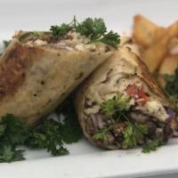 Jerk Chicken Wrap Only · Jerked chicken wrapped with rice and peas, lettuce, tomato, cheese, cabbage, and mango salsa.