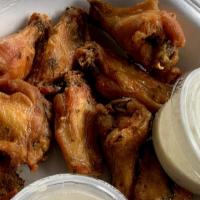 Wings · Fried and tossed in your choice of: Mild, hot, BBQ, Jamaican jerk, teriyaki, and garlic Parm...