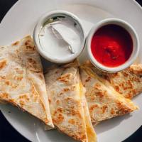 Breakfast Quesadilla · New. A grilled tortilla stuffed with ham, mozzarella, cheddar, and of course eggs. Served wi...