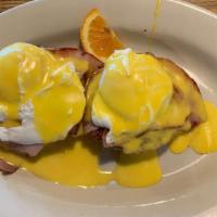 Hawg Benedict · Poached egg, bacon, sausage, and ham on an English muffin or biscuit with choice of hollanda...