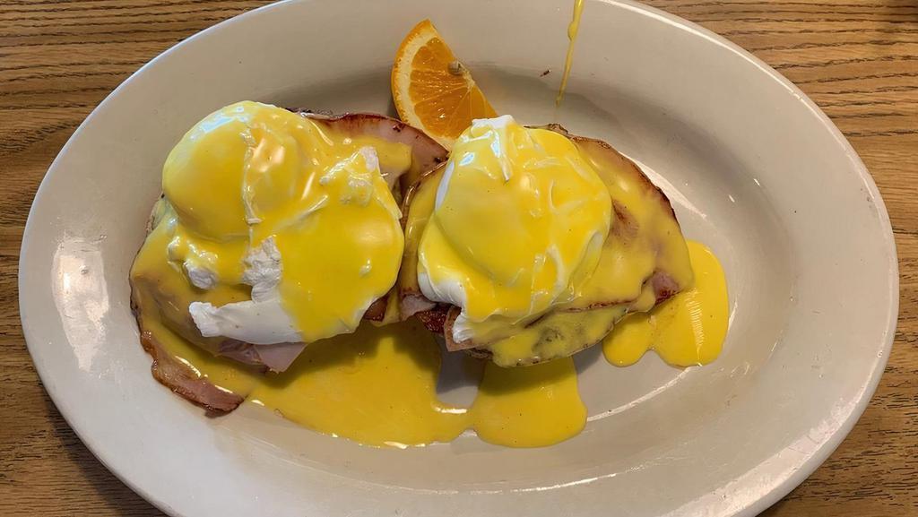 Hawg Benedict · Poached egg, bacon, sausage, and ham on an English muffin or biscuit with choice of hollandaise sauce or gravy.