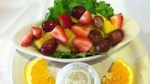 Fresh Fruit · Small serving of fresh fruit consisting of cantaloupe, honey dew, strawberries, grapes and pineapple